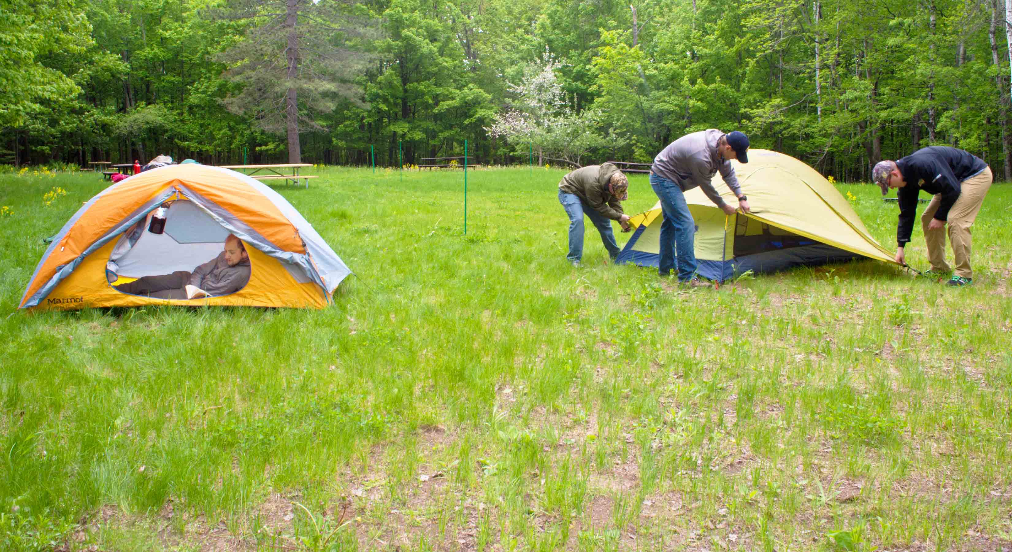 a group setting up tents at the UMD Bagley Campground