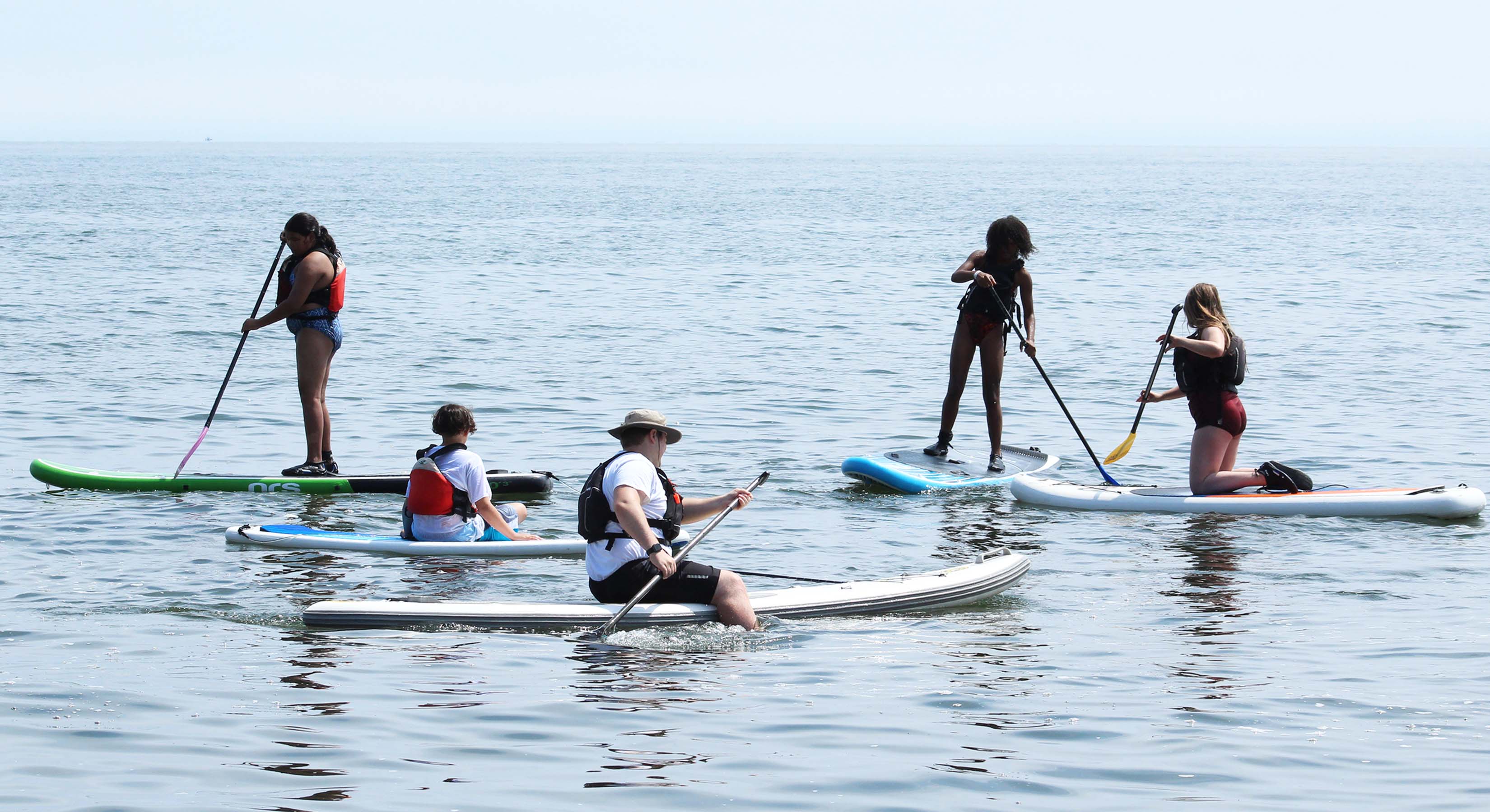 a group paddling SUP's on Lake Superior