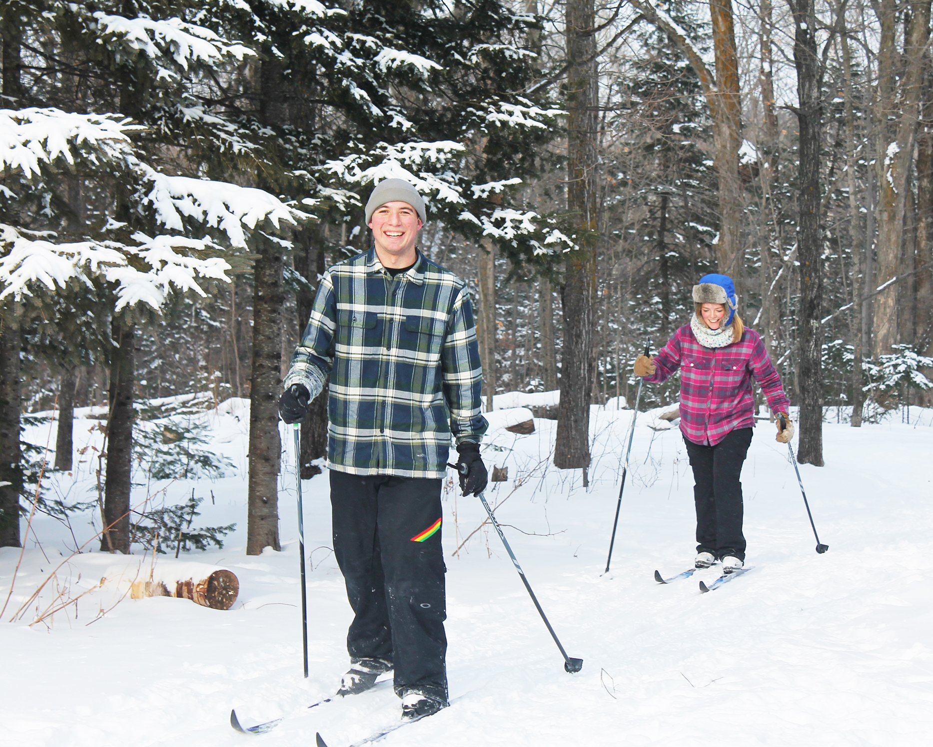 two students cross country skiing