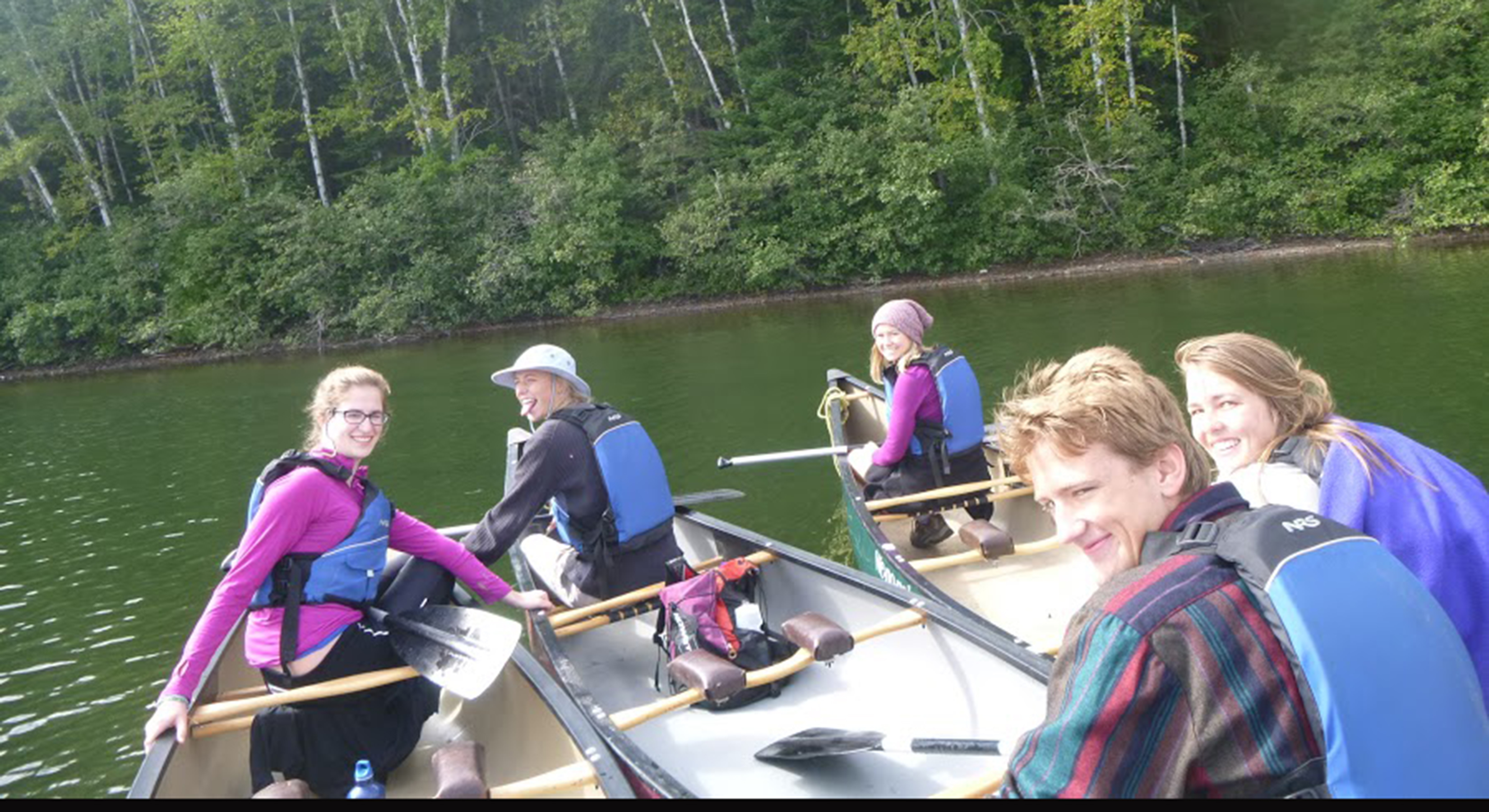 students sitting in canoes in the Boundary Waters