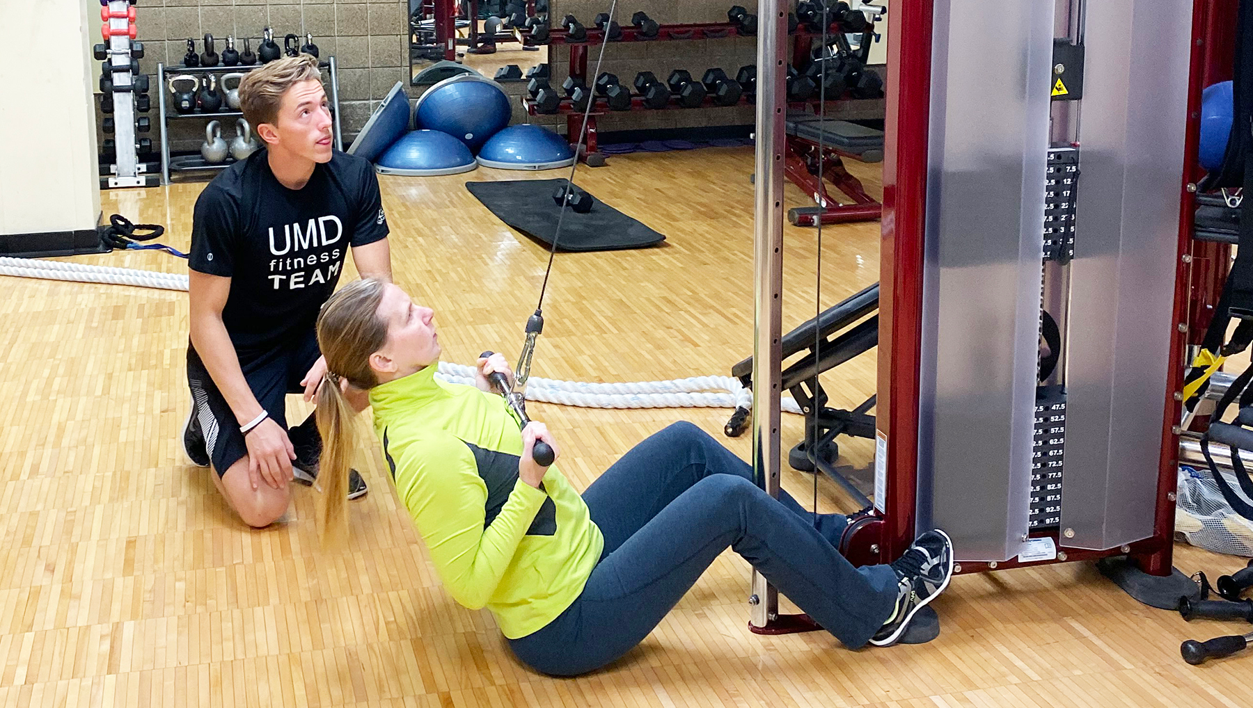personal trainer working with a client