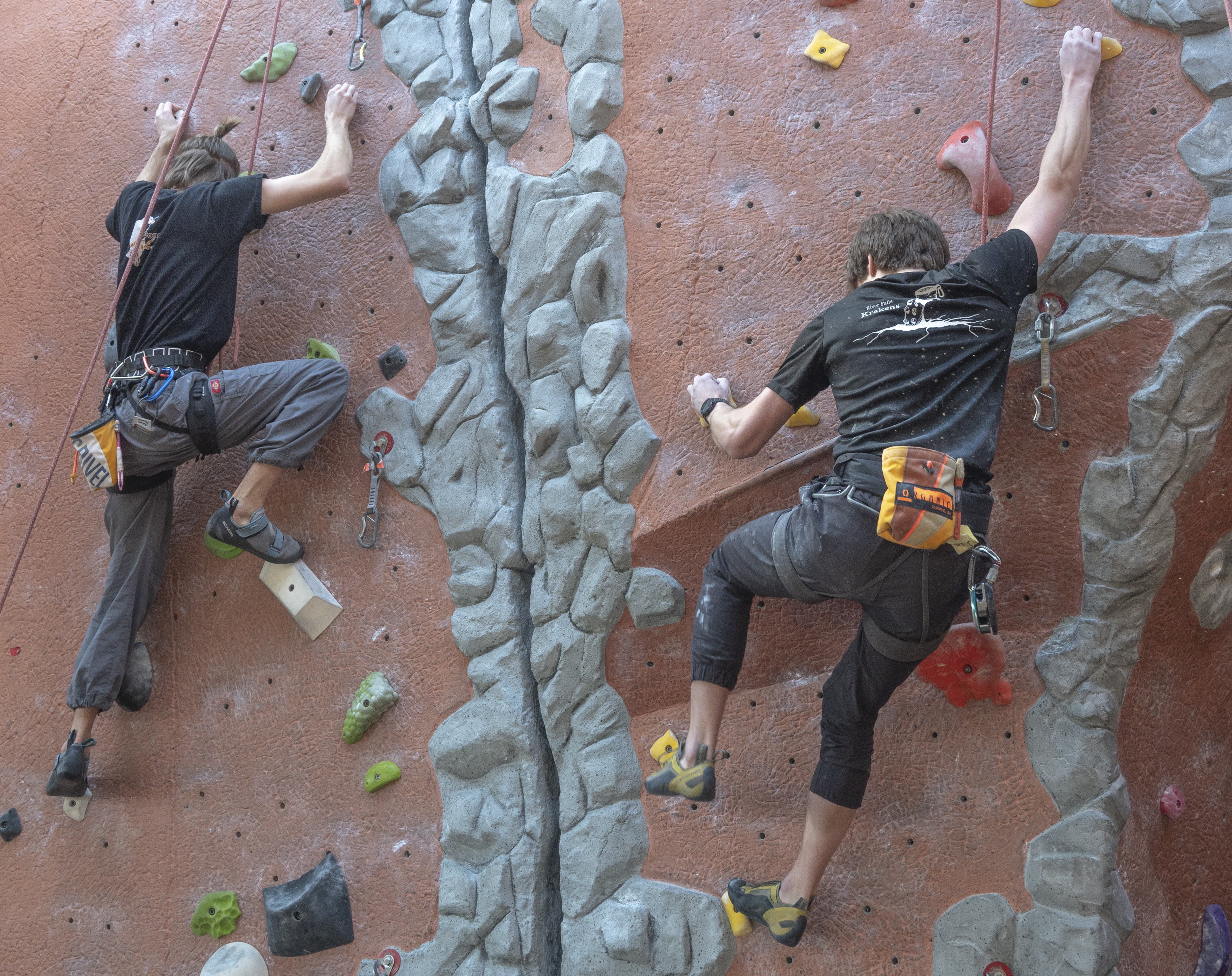 two students indoor rock climbing